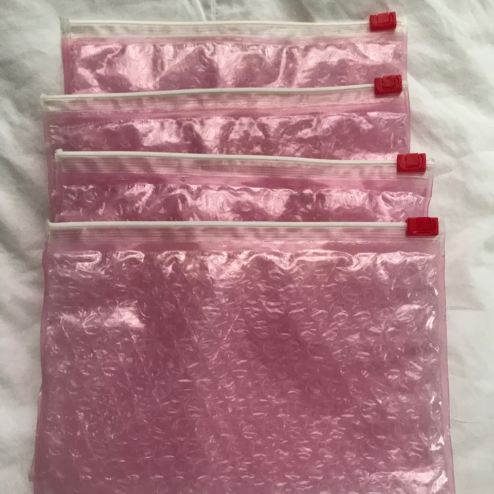 4 New and/or Gently Used Glossier Pink Bubble Bags/Pouches